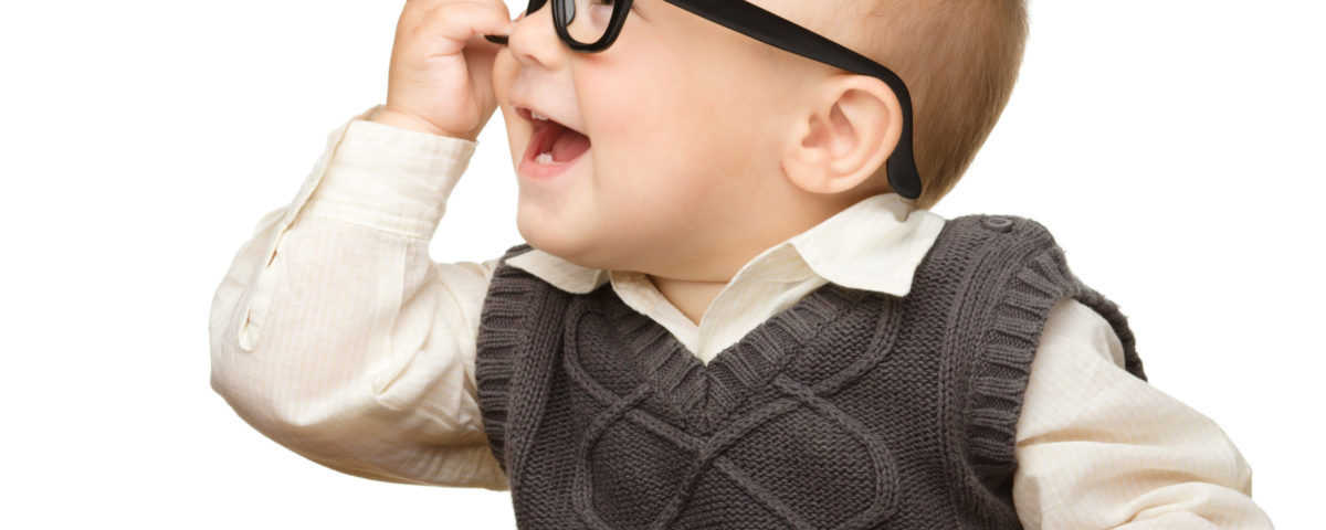 Baby reading and wearing glasses