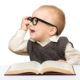 Baby reading and wearing glasses
